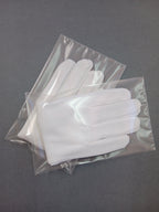 Guants blancs de cotó